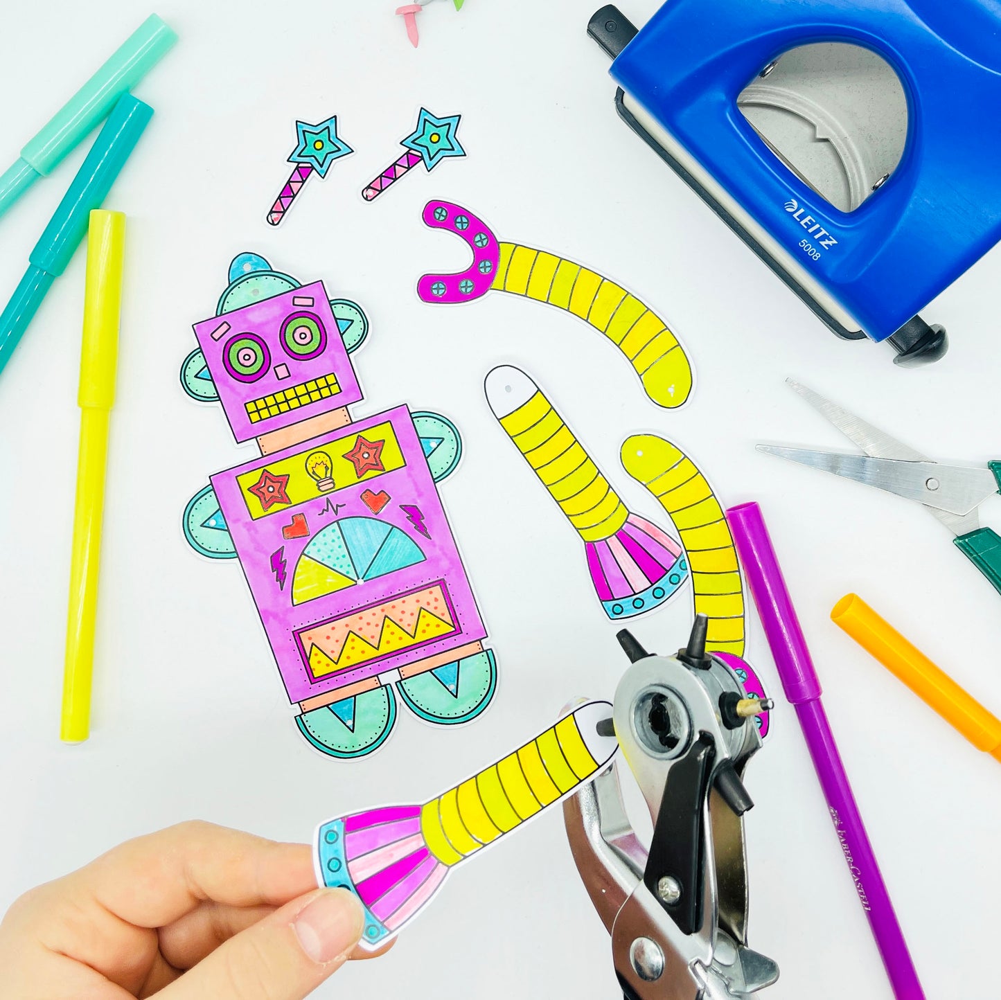 punching the holes for a robot kids craft