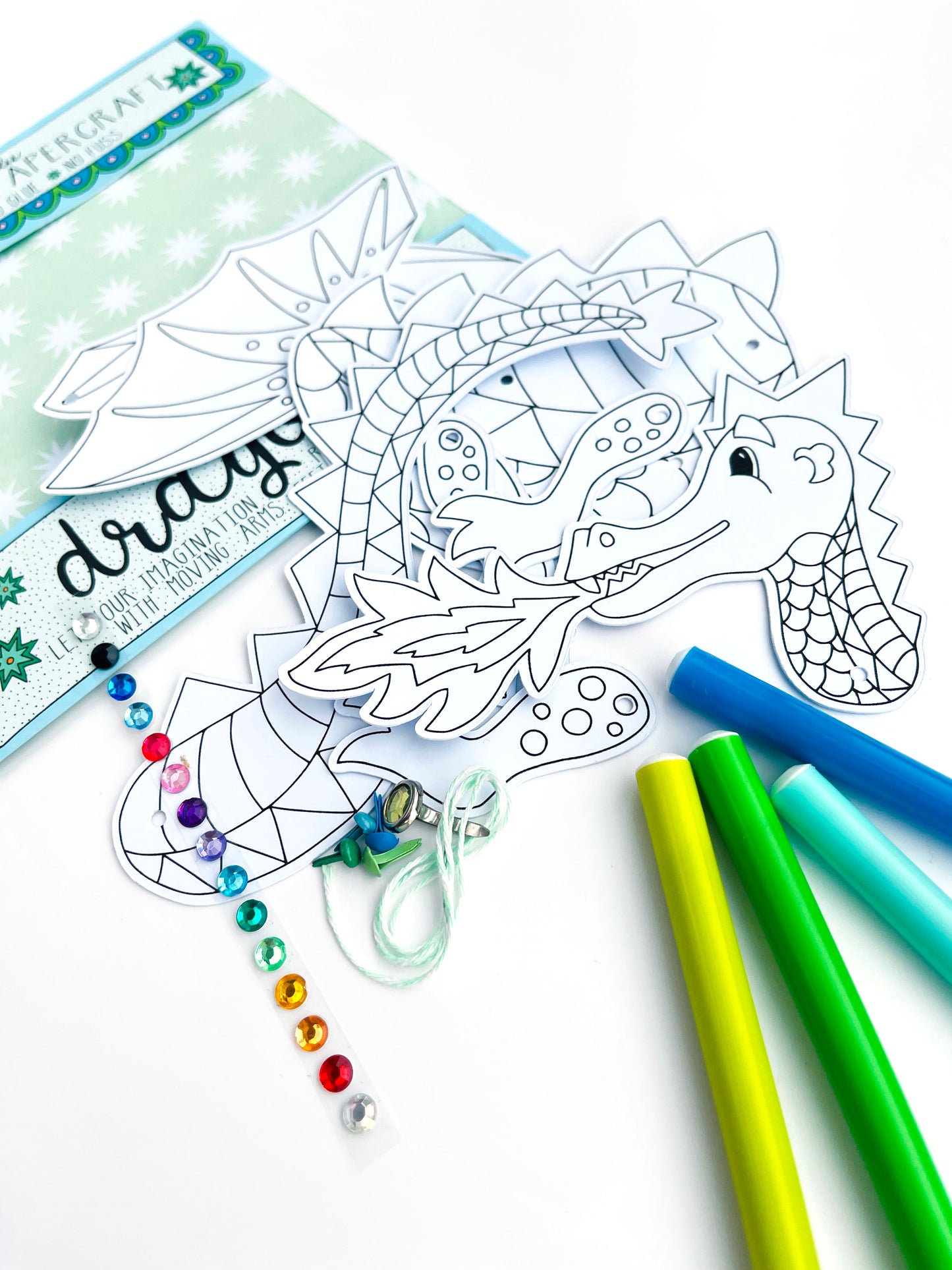 dragon craft. dragon pieces pre cut from 300gsm card and all the materials inside the kit
