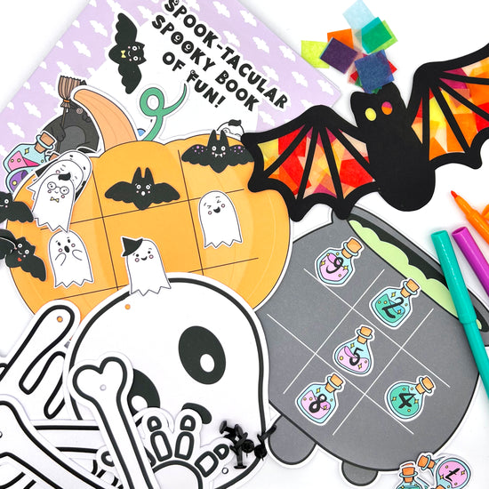 Halloween activity box includes extra large skeleton, sun catchers, pumpkin game, witches cauldron game and an activity booklet with quizzes and colouring.