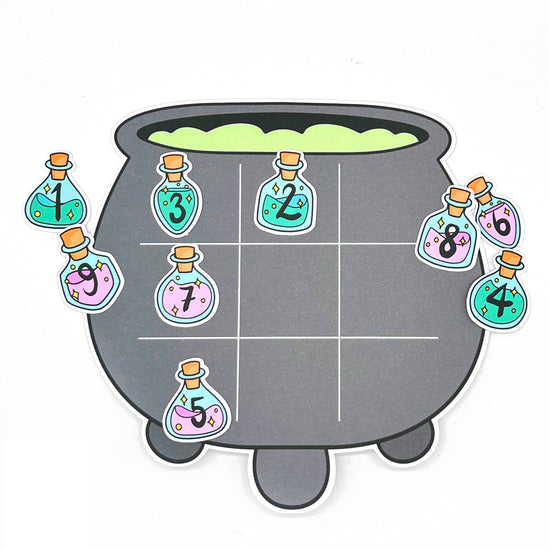 A halloween number game. A cauldron playing board with potion bottle playing pieces numbered 1 to 9